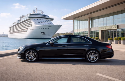Black executive saloon outside a cruise terminal